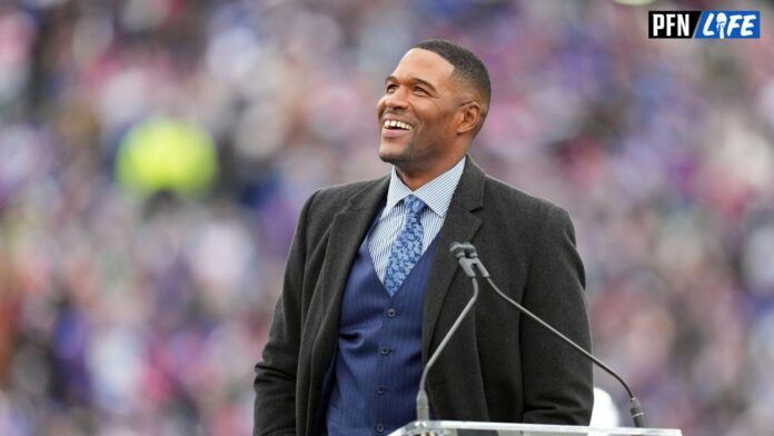 New York Giants former player Michael Strahan reacts at his jersey retirement ceremony at halftime of a game against the Carolina Panthers at MetLife Stadium.