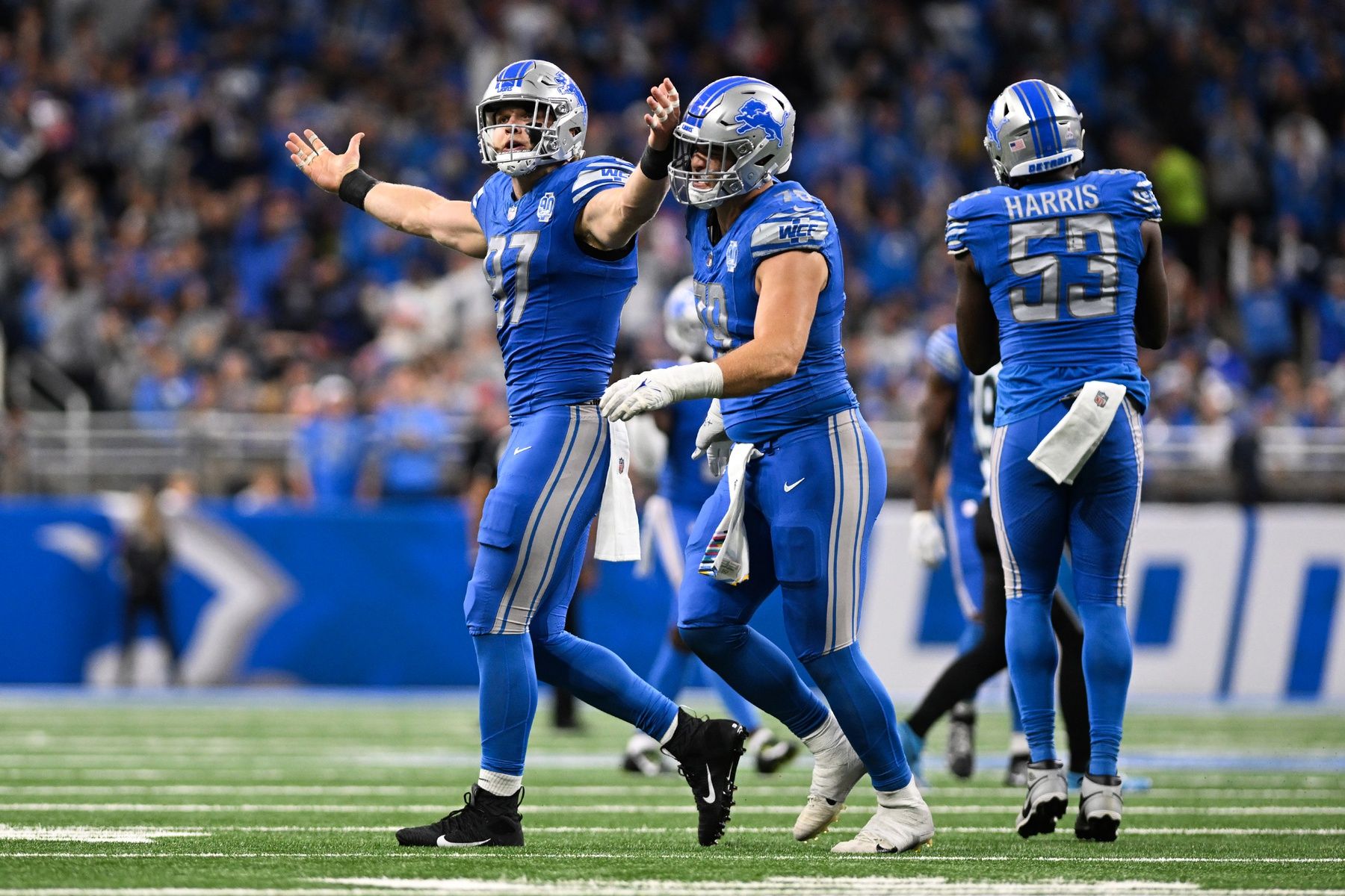 Detroit Lions DE Aidan Hutchinson (97) attempts to fire up the crowd after a play.