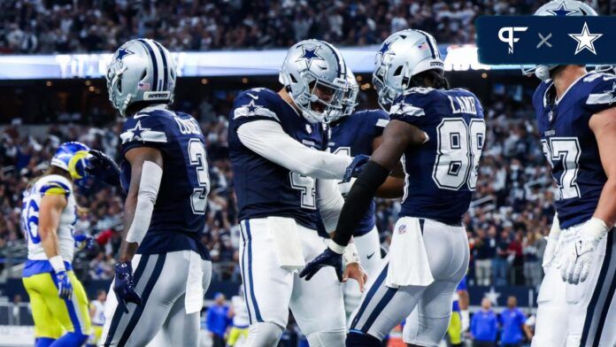 Dallas Cowboys wide receiver CeeDee Lamb (88) celebrates with Dallas Cowboys quarterback Dak Prescott (4) after catching a touchdown pass during the first half against the Los Angeles Rams at AT&T Stadium.