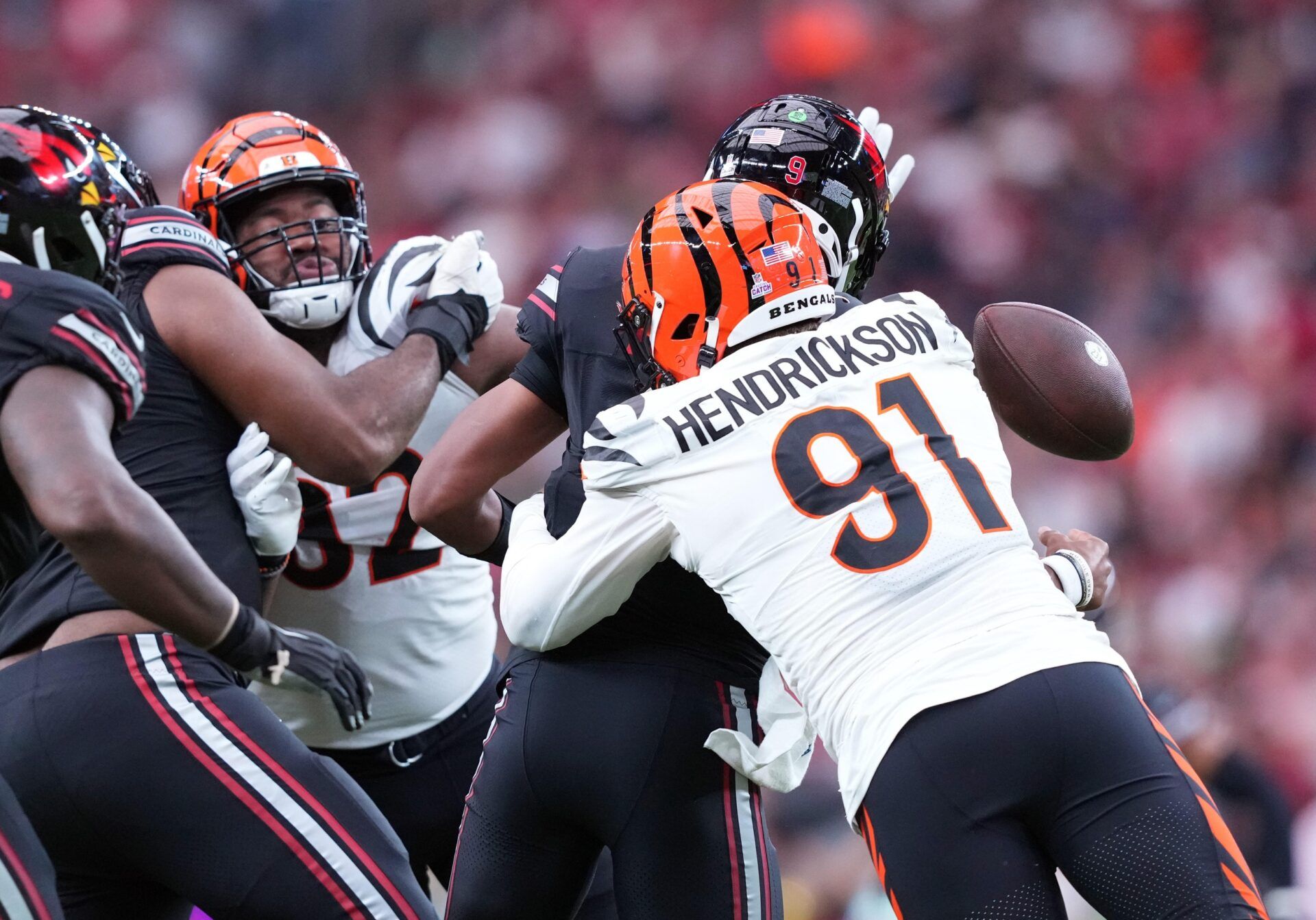 Arizona Cardinals quarterback Joshua Dobbs (9) is sacked by Cincinnati Bengals defensive end Trey Hendrickson (91) and fumbles during the second half at State Farm Stadium.