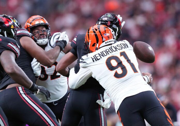 Arizona Cardinals quarterback Joshua Dobbs (9) is sacked by Cincinnati Bengals defensive end Trey Hendrickson (91) and fumbles during the second half at State Farm Stadium.