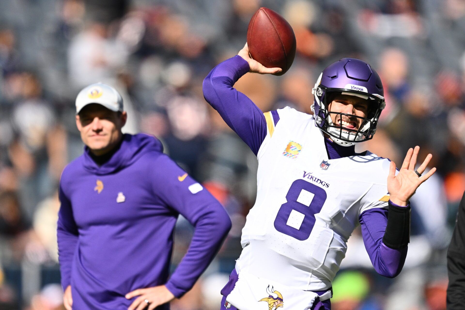 Kirk Cousins (8) warms up before a game against the Chicago Bears at Soldier Field.