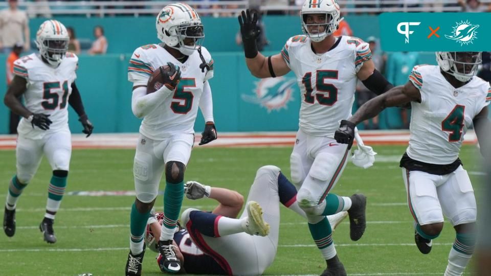 Jalen Ramsey (5) intercepts a pass against the New England Patriots during the first half of an NFL game at Hard Rock Stadium.