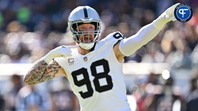 Maxx Crosby (98) reacts after the Chicago Bears jumped the snap in the third quarter at Soldier Field.