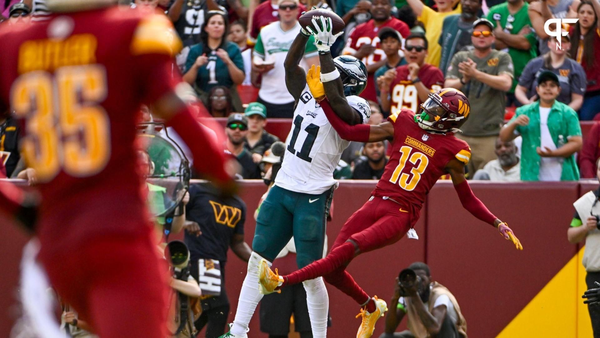 Philadelphia Eagles wide receiver A.J. Brown (11) scores a touchdown against the Washington Commanders during the second half at FedExField.