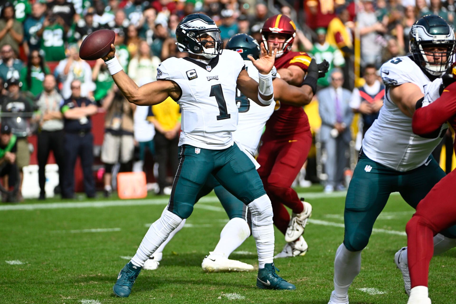 Philadelphia Eagles quarterback Jalen Hurts (1) attempts a pass against the Washington Commanders during the first half at FedExField.