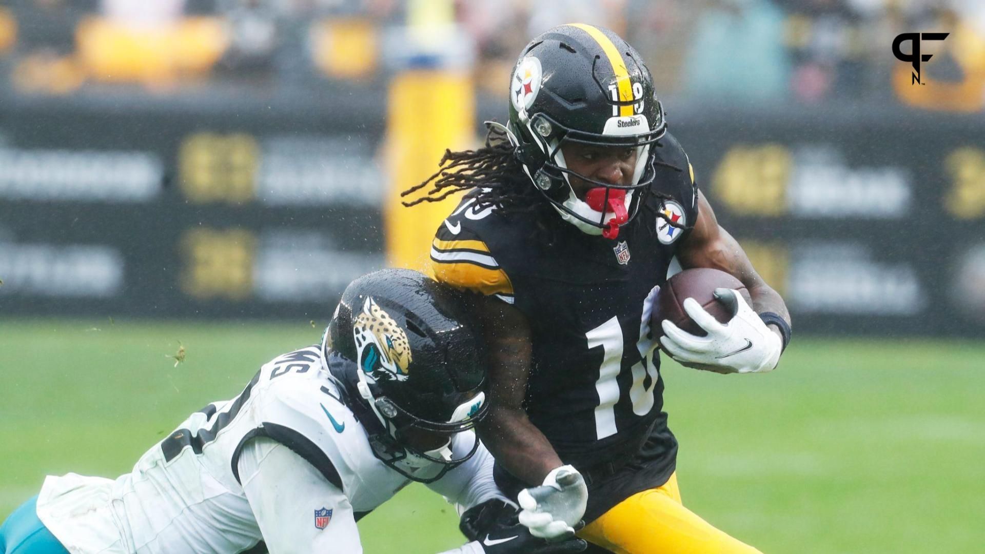 Pittsburgh Steelers wide receiver Diontae Johnson (18) runs after a catch against Jacksonville Jaguars cornerback Darious Williams (31) during the second quarter at Acrisure Stadium.