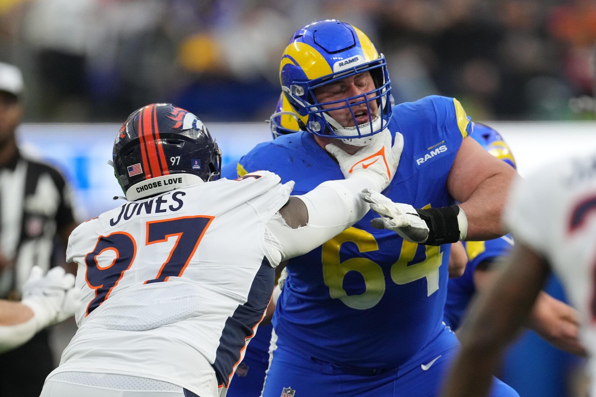 Los Angeles Rams center Matt Skura (64) defends against Denver Broncos defensive tackle D.J. Jones (97) in the second half at SoFi Stadium.