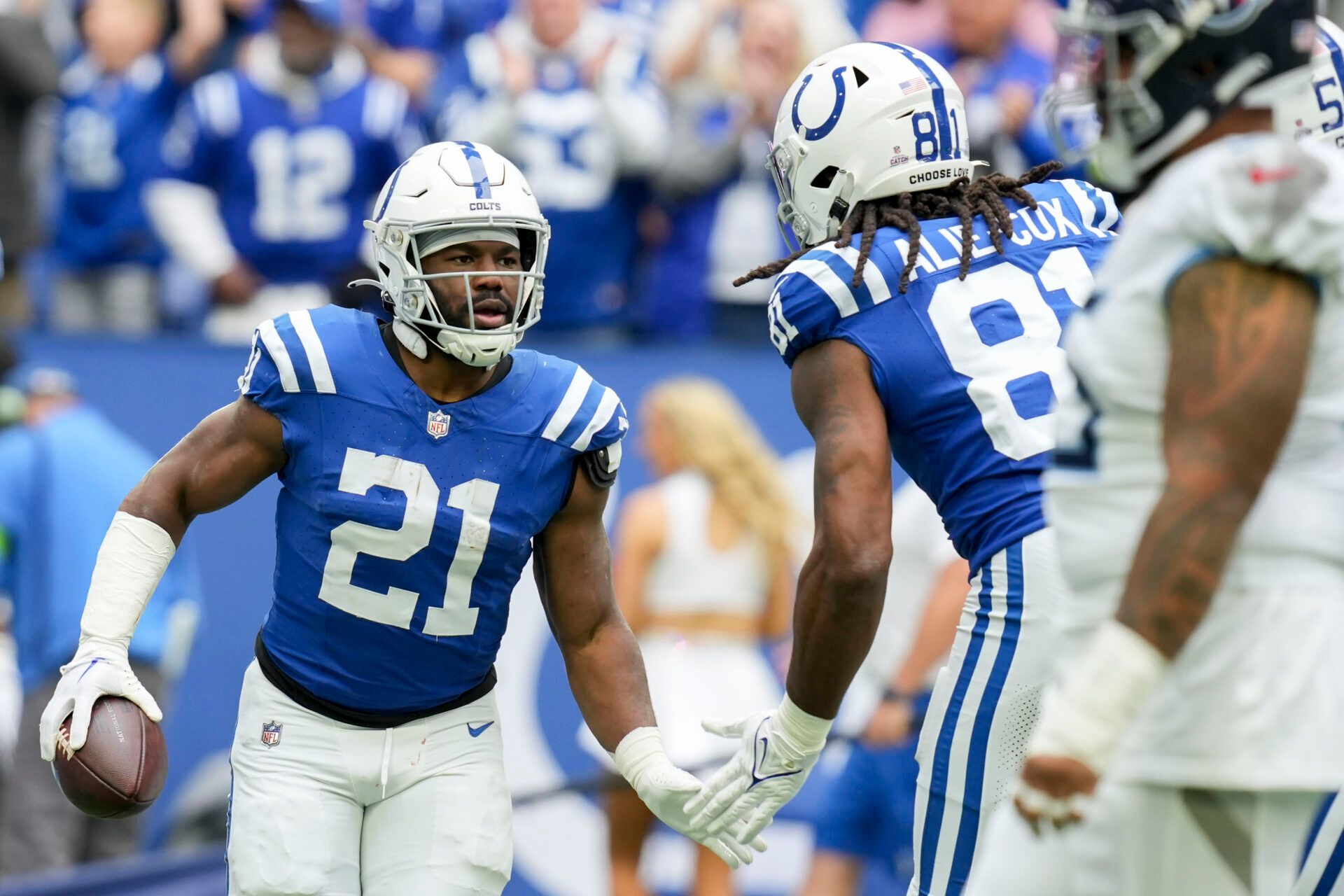 Indianapolis Colts running back Zack Moss (21) gets a high five from Indianapolis Colts tight end Mo Alie-Cox (81) after rushing for a touchdown during a game against the Tennessee Titans.