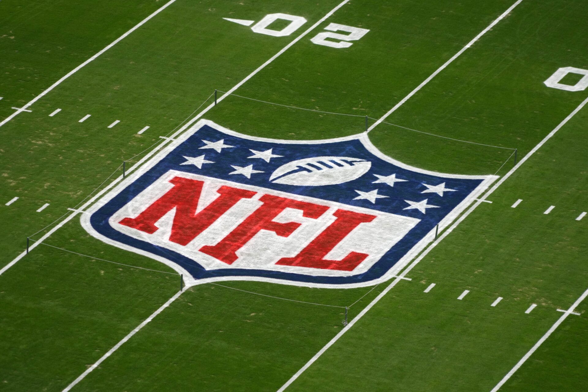 An aerial view of the NFL logo on the field.