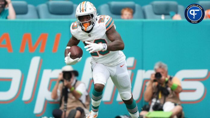 Jeff Wilson Jr. (23) runs the ball against the New England Patriots during the second half at Hard Rock Stadium.