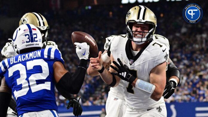 Taysom Hill (7) celebrates a touchdown during the second half against the Indianapolis Colts at Lucas Oil Stadium.