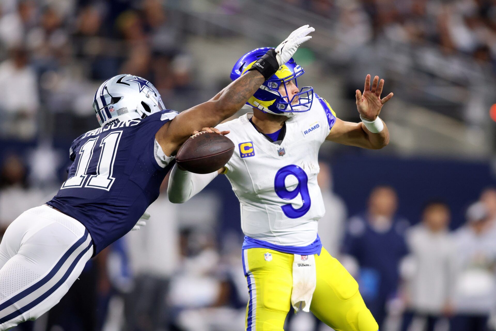 Los Angeles Rams QB Matthew Stafford (9) attempts to make a pass against the Dallas Cowboys.