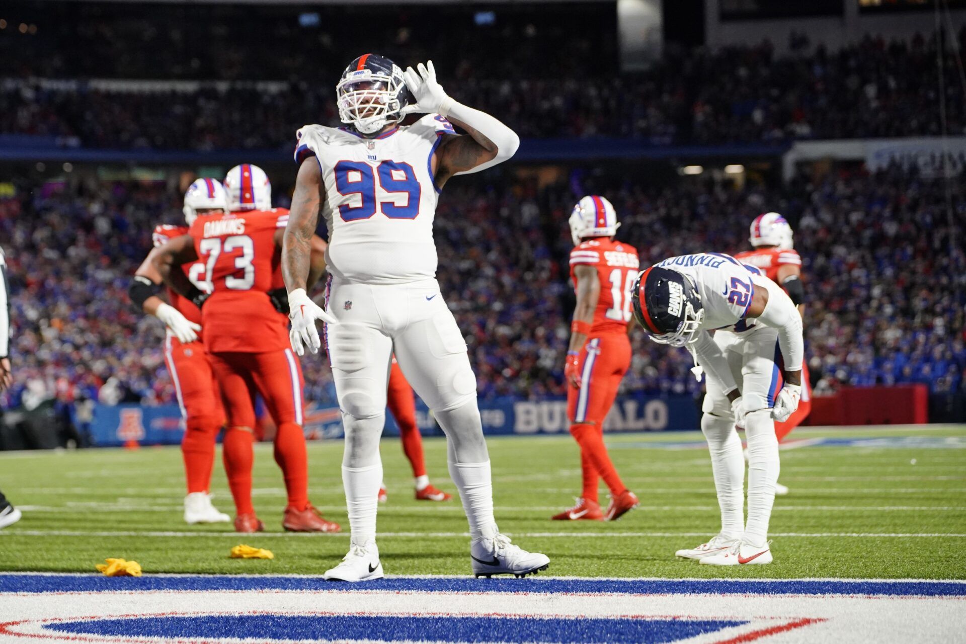 Leonard Williams (99) lets the crowd know he can’t hear them during the second half against the Buffalo Bills at Highmark Stadium.