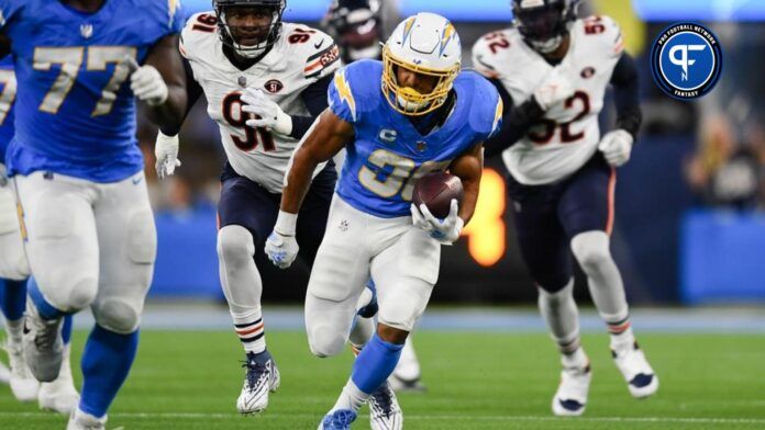 Austin Ekeler (30) runs the ball against Los Angeles Chargers defensive tackle Christopher Hinton (91) during the second quarter at SoFi Stadium.