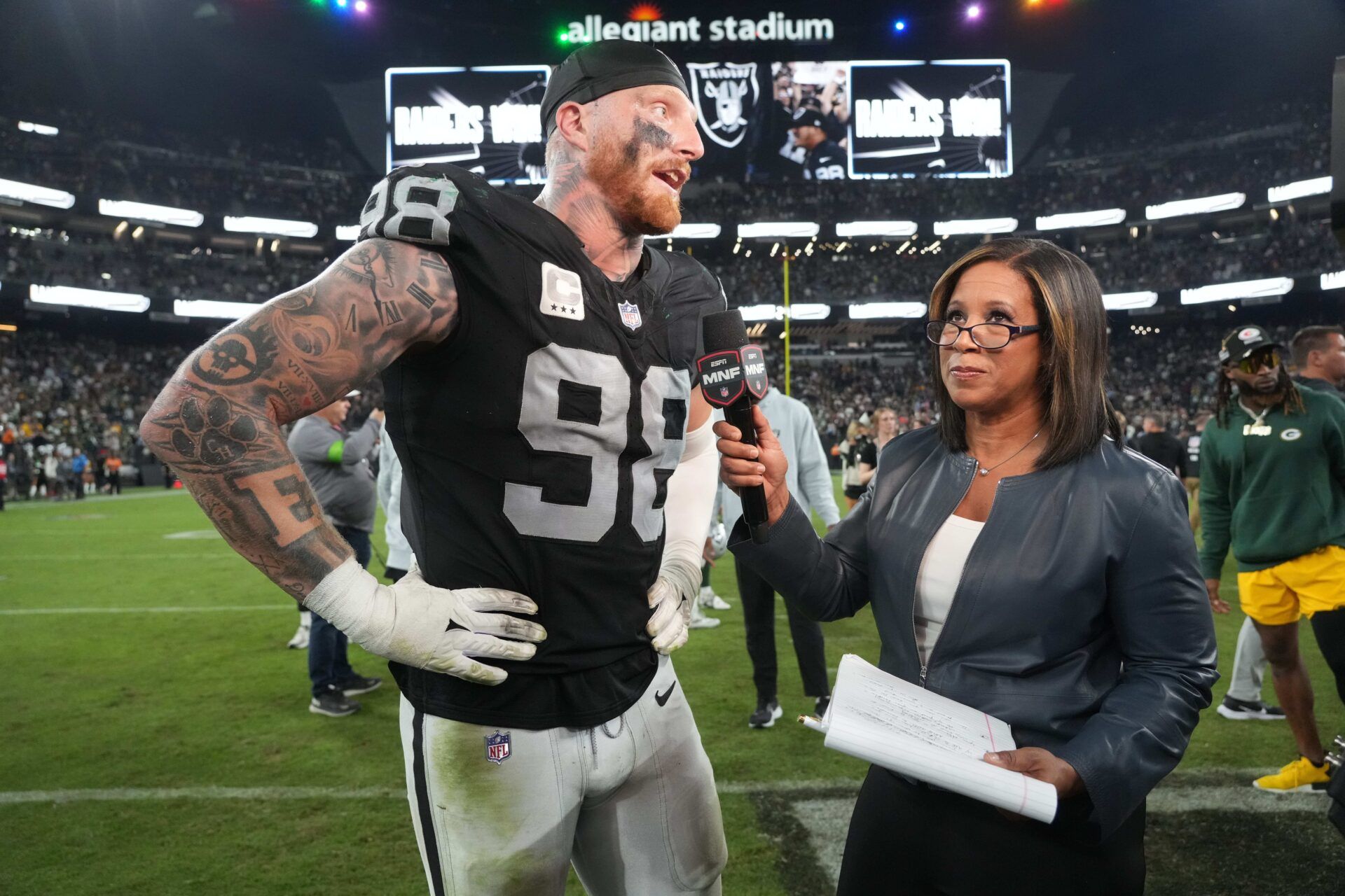 Las Vegas Raiders defensive end Maxx Crosby (98) is interviewed by ESPN sideline reporter Lisa Saltes after the game against the Green Bay Packers at Allegiant Stadium.