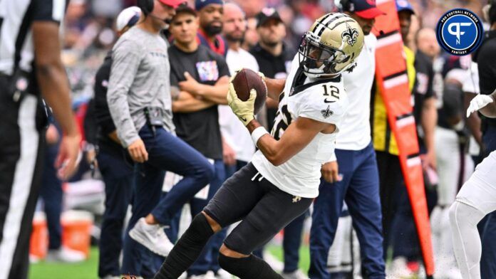 Chris Olave (12) runs out of bounds during the second quarter at NRG Stadium.