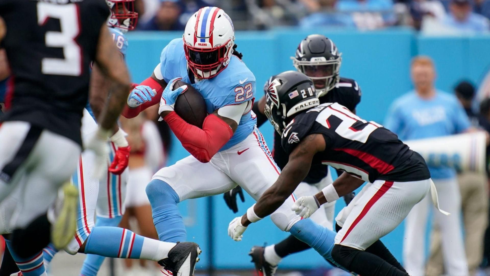 Tennessee Titans running back Derrick Henry (22) evades Atlanta Falcons cornerback Dee Alford (20) during the third quarter at Nissan Stadium in Nashville, Tenn., Sunday, Oct. 29, 2023.