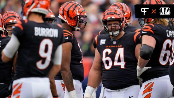 Ted Karras (64) awaits a play in the huddle during the first quarter of the NFL Week 6 game between the Cincinnati Bengals and the Seattle Seahawks at Paycor Stadium.