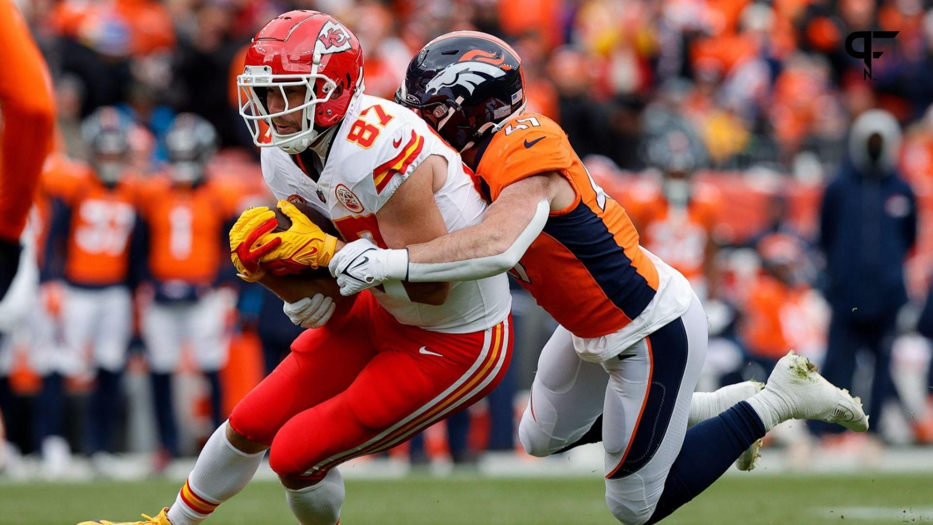 Kansas City Chiefs tight end Travis Kelce (87) is tackled by Denver Broncos linebacker Josey Jewell (47) in the first quarter at Empower Field at Mile High.