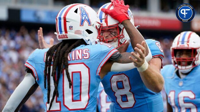 Tennessee Titans wide receiver DeAndre Hopkins (10) celebrates his touchdown against the Atlanta Falcons with quarterback Will Levis (8).