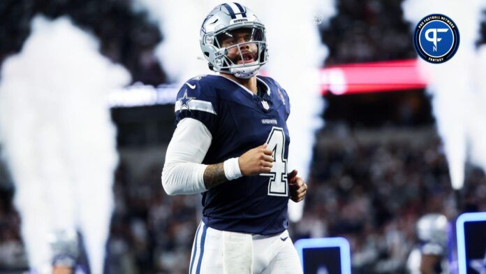 Dallas Cowboys quarterback Dak Prescott (4) runs onto the field before the game against the Los Angeles Rams at AT&T Stadium.