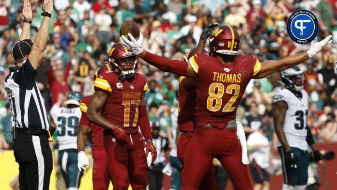 Washington Commanders tight end Logan Thomas (82) celebrates with teammates after scoring a touchdown against the Philadelphia Eagles during the fourth quarter at FedExField.