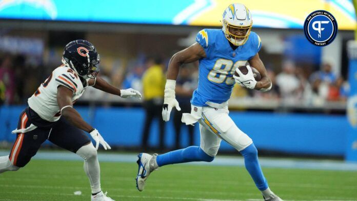 Los Angeles Chargers tight end Donald Parham Jr. (89) carries the ball against Chicago Bears defensive back Elijah Hicks (22) in the first half at SoFi Stadium.