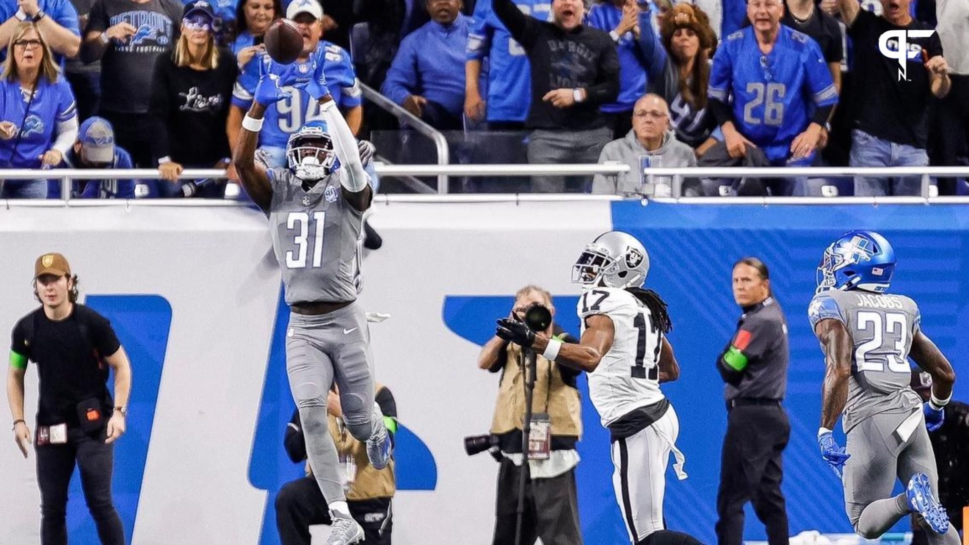 Lions safety Kerby Joseph intercepts a pass intended for Raiders wide receiver Davante Adams during the first half at Ford Field on Monday, Oct. 30, 2023.