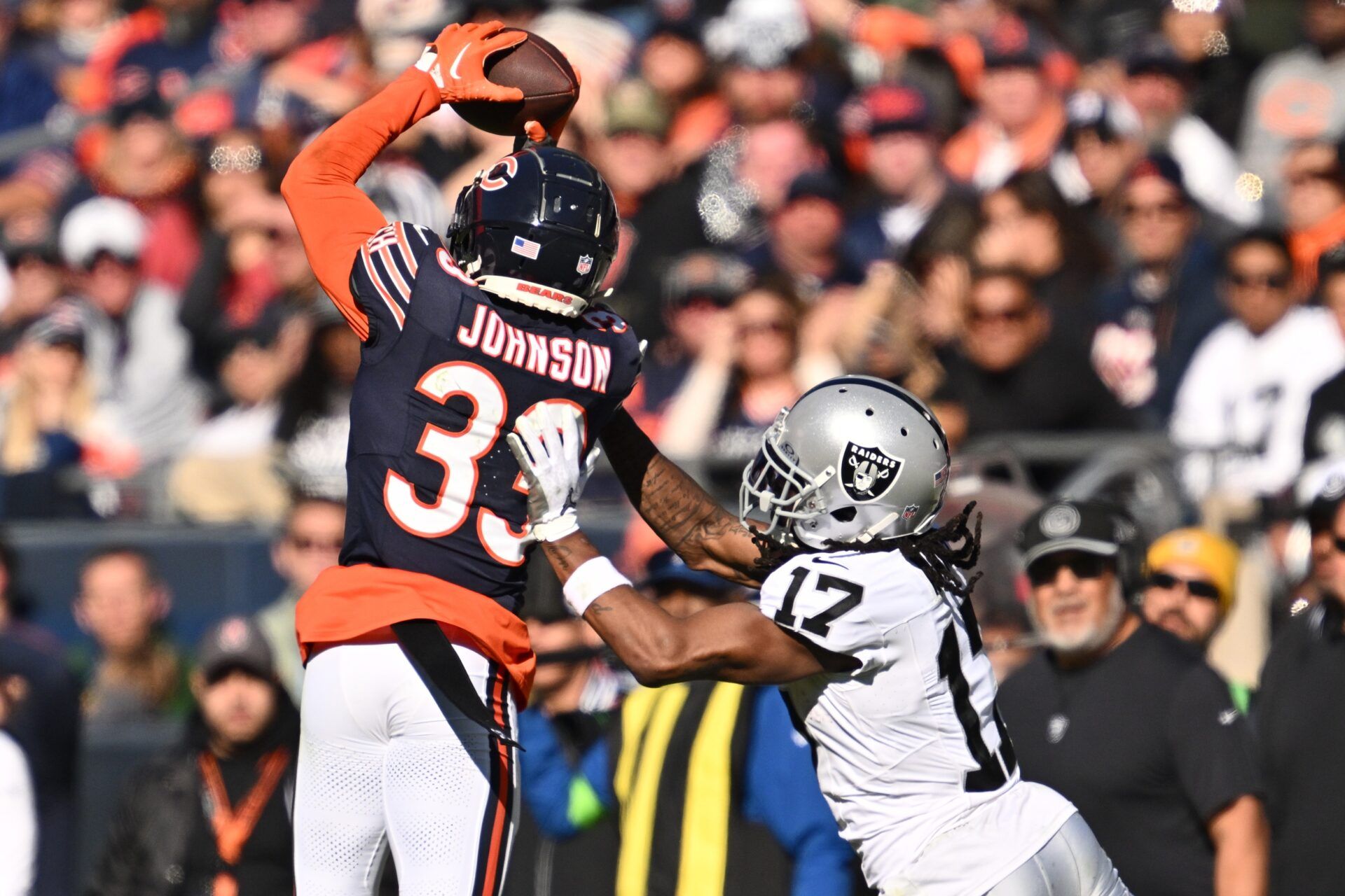 Chicago Bears CB Jaylon Johnson (33) steps in front of Las Vegas Raiders WR Davante Adams (17) for the interception.