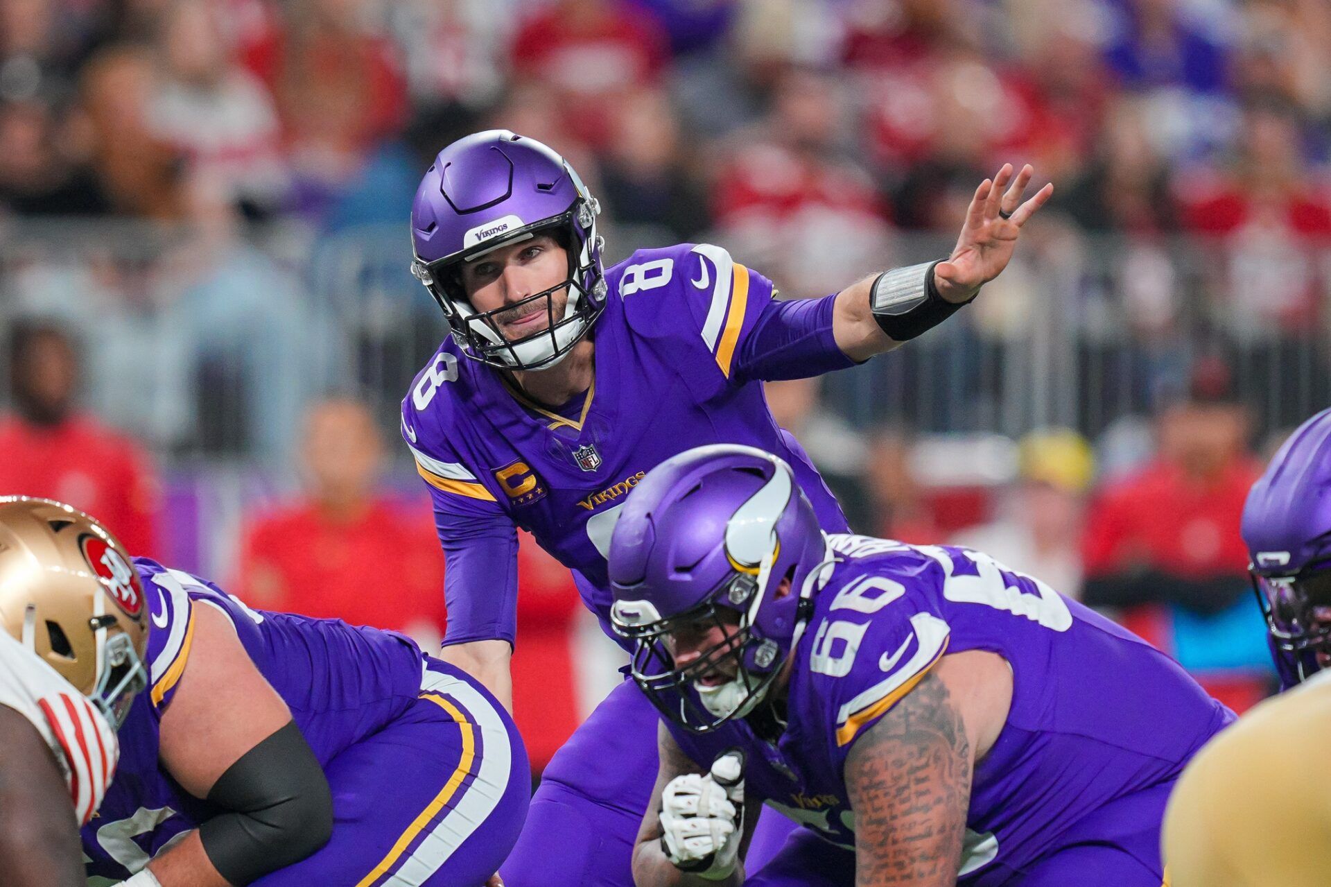 Minnesota Vikings quarterback Kirk Cousins (8) signals his team against the San Francisco 49ers.