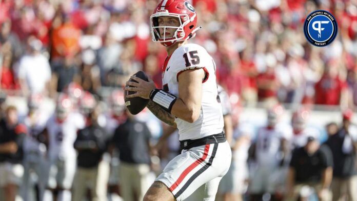 Georgia Bulldogs quarterback Carson Beck (15) looks to pass in the first half against the Florida Gators at EverBank Stadium.