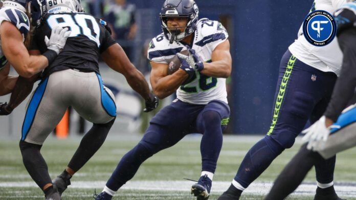 Seattle Seahawks running back Zach Charbonnet (26) rushes against the Carolina Panthers during the fourth quarter at Lumen Field.