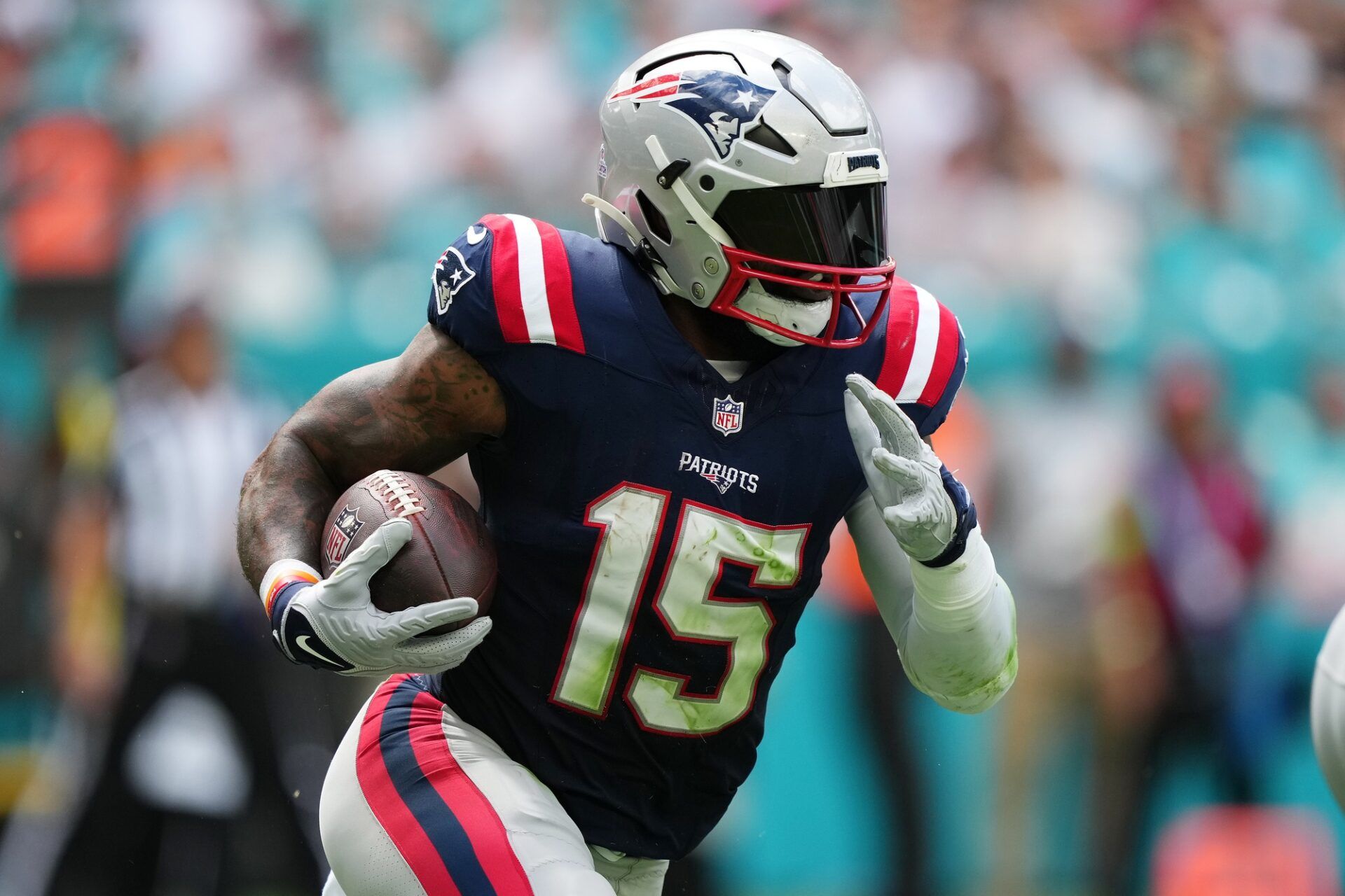 New England Patriots RB Ezekiel Elliott (15) runs the ball against the Miami Dolphins.