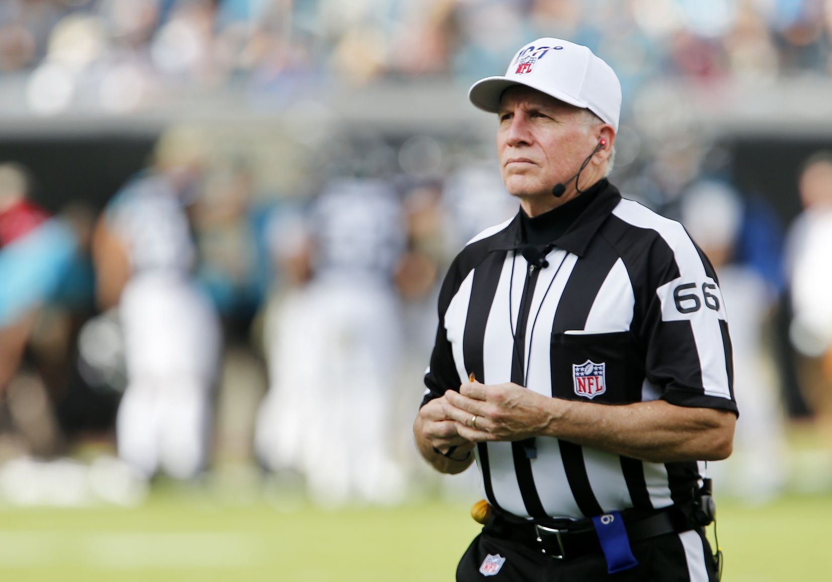 Referee Walt Anderson walks to the sidelines during a game.