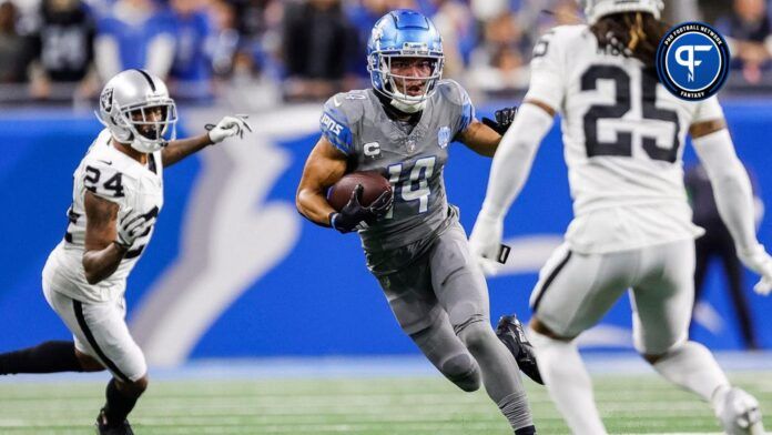 Lions wide receiver Amon-Ra St. Brown runs against Raiders safety Tre'von Moehrig during the first half at Ford Field on Monday, Oct. 30, 2023.