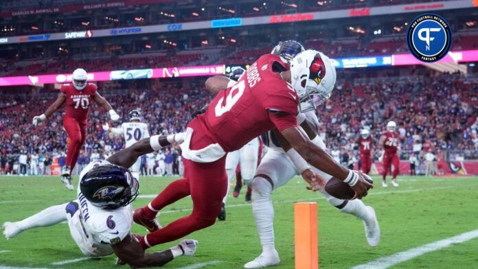 Arizona Cardinals QB Joshua Dobbs (9) reaches for the goal line against the Baltimore Ravens.