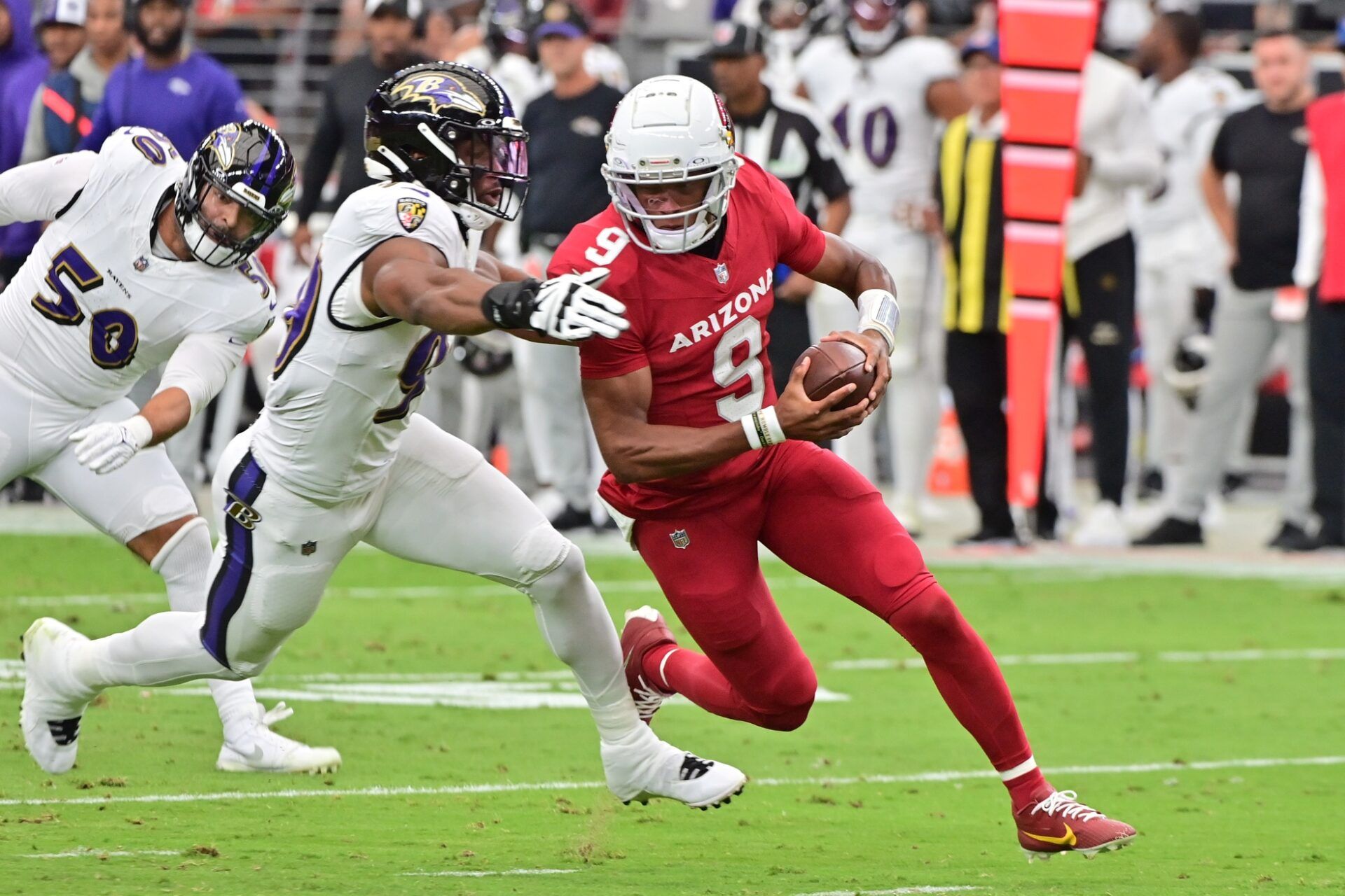 Arizona Cardinals QB Joshua Dobbs (9) escapes a tackle against the Baltimore Ravens.