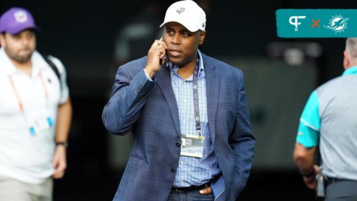 Miami Dolphins GM Chris Grier on the phone.