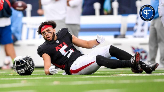 Atlanta Falcons wide receiver Drake London (5) lays on the field after taking a hit from Tennessee Titans linebacker Jack Gibbens (50) during the second half at Nissan Stadium.