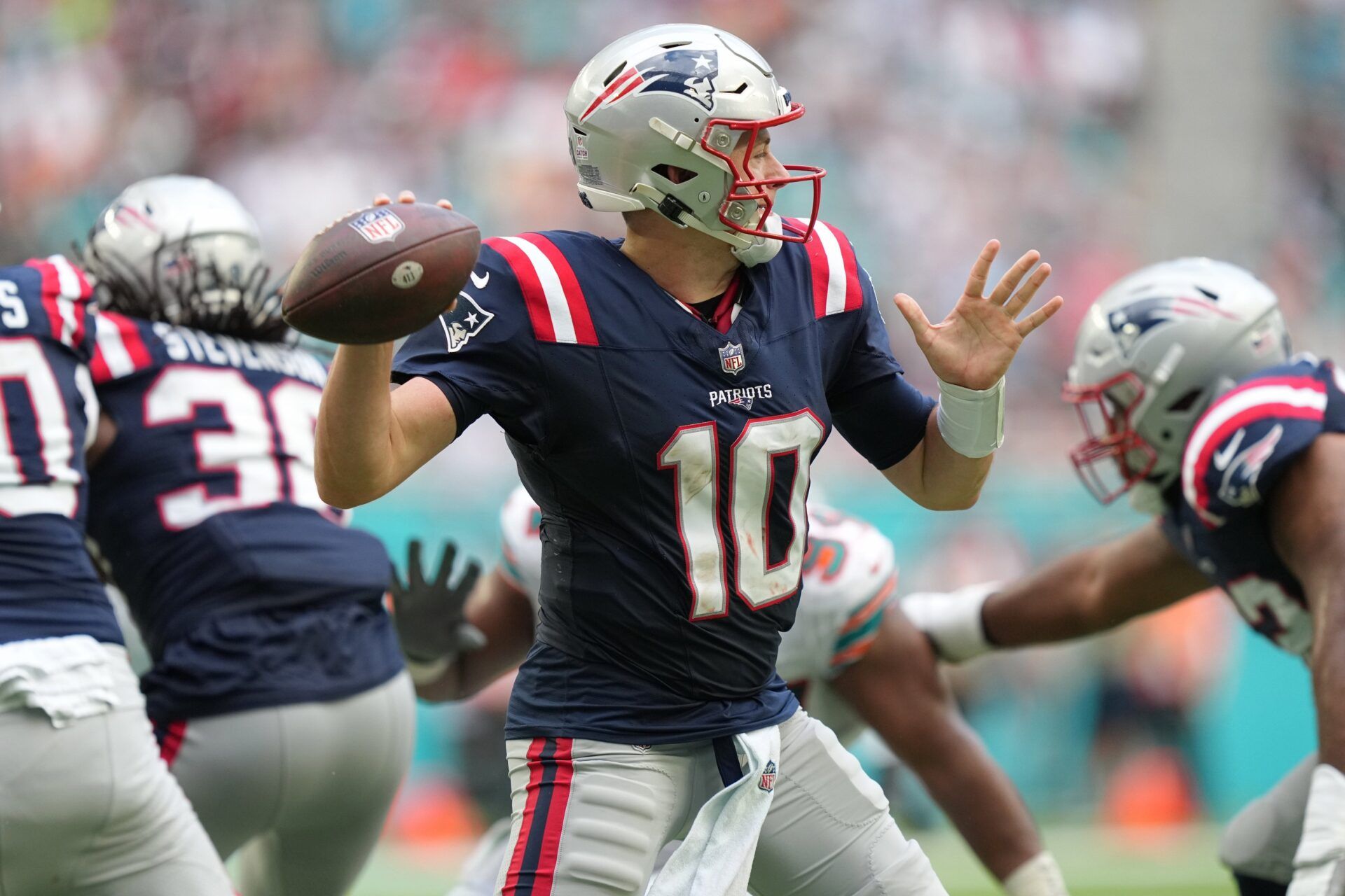 New England Patriots quarterback Mac Jones (10) drops back to pass against the Miami Dolphins during the second half of an NFL game at Hard Rock Stadium in Miami Gardens, Oct. 29, 2023.