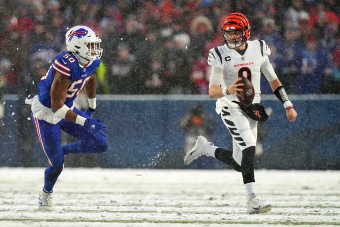 Cincinnati Bengals QB Joe Burrow (9) rolls out against the Buffalo Bills.