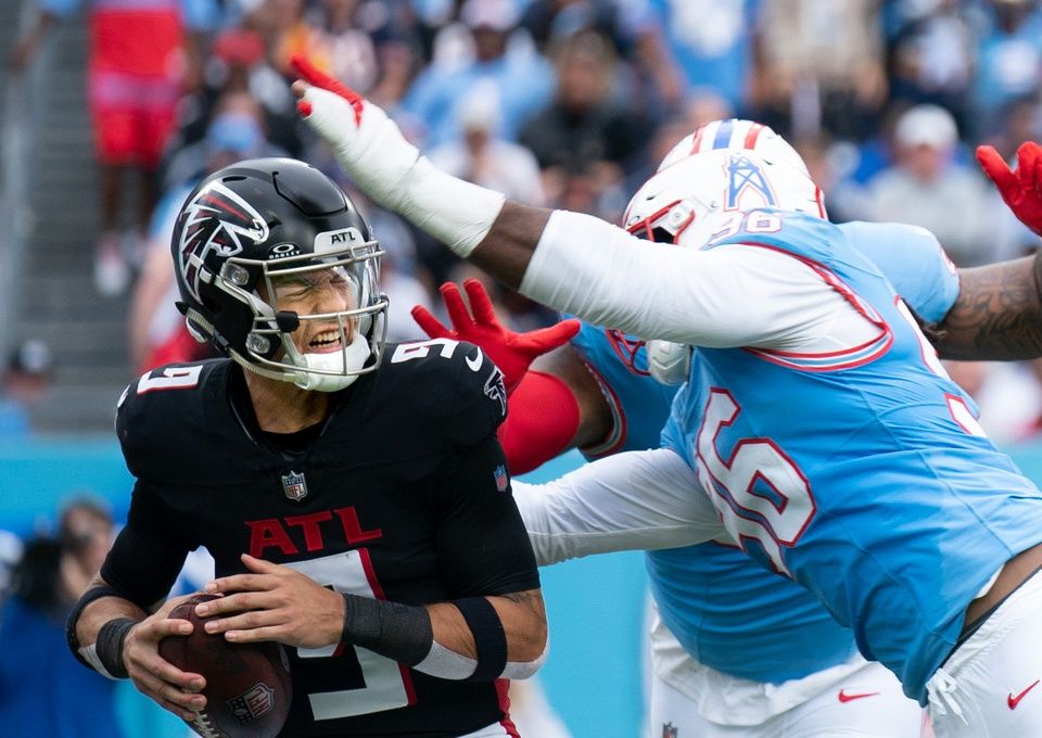 Tennessee Titans defensive end Denico Autry (96) and defensive tackle Jeffery Simmons (98) converge on Atlanta Falcons quarterback Desmond Ridder (9) for a sack in the second quarter at Nissan Stadium.