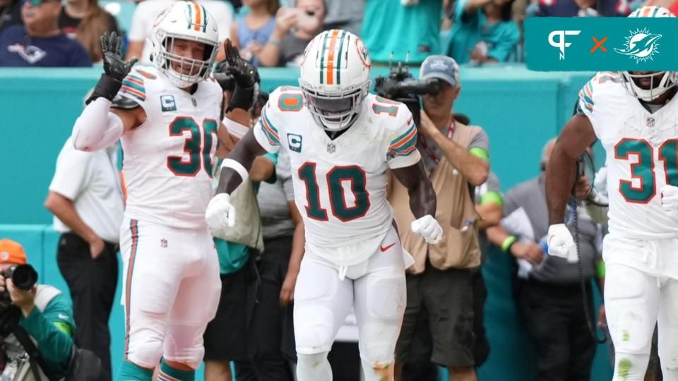 Raheem Mostert (31) celebrates his touchdown against the New England Patriots with wide receiver Tyreek Hill (10) by doing a speed walk celebration in the end zone during the second half at Hard Rock Stadium.