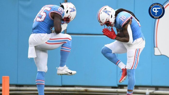 DeAndre Hopkins (10) and tight end Chigoziem Okonkwo (85) celebrate after a touchdown during the second half against the Atlanta Falcons at Nissan Stadium.