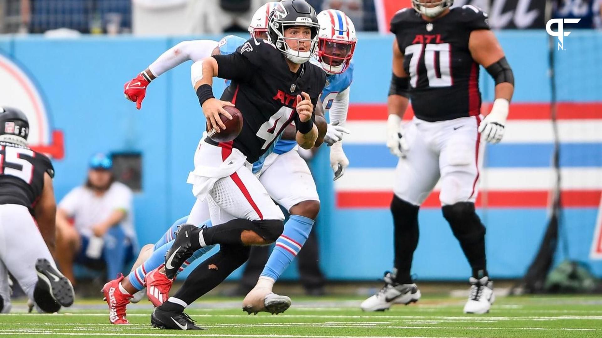 Atlanta Falcons quarterback Taylor Heinicke (4) runs with the ball against the Tennessee Titans during the second half at Nissan Stadium.