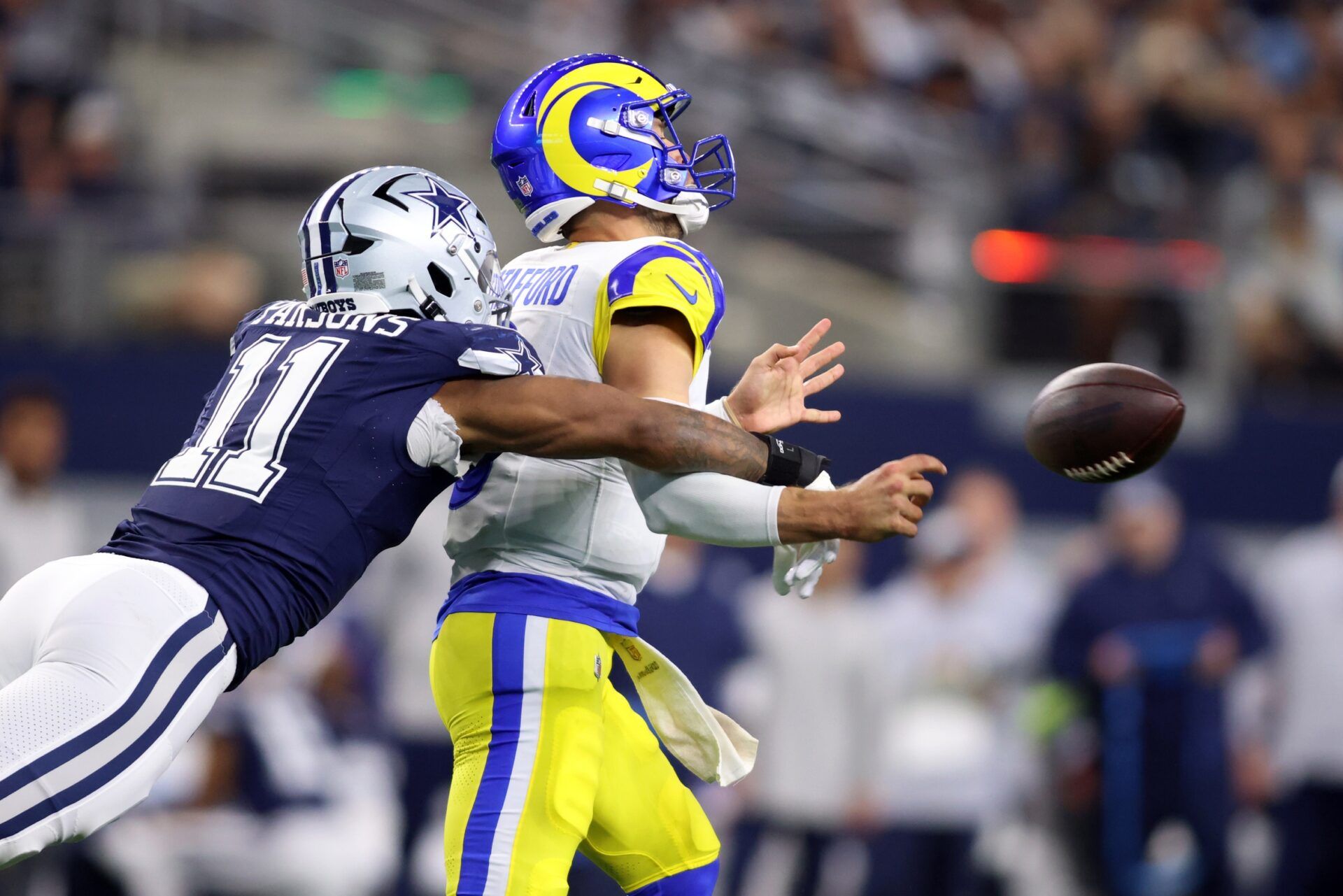 Dallas Cowboys linebacker Micah Parsons (11) attempts to sack Los Angeles Rams quarterback Matthew Stafford (9) in the second quarter at AT&T Stadium.