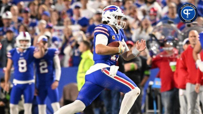 Josh Allen (17) runs for a first down in the third quarter against the Tampa Bay Buccaneers at Highmark Stadium.