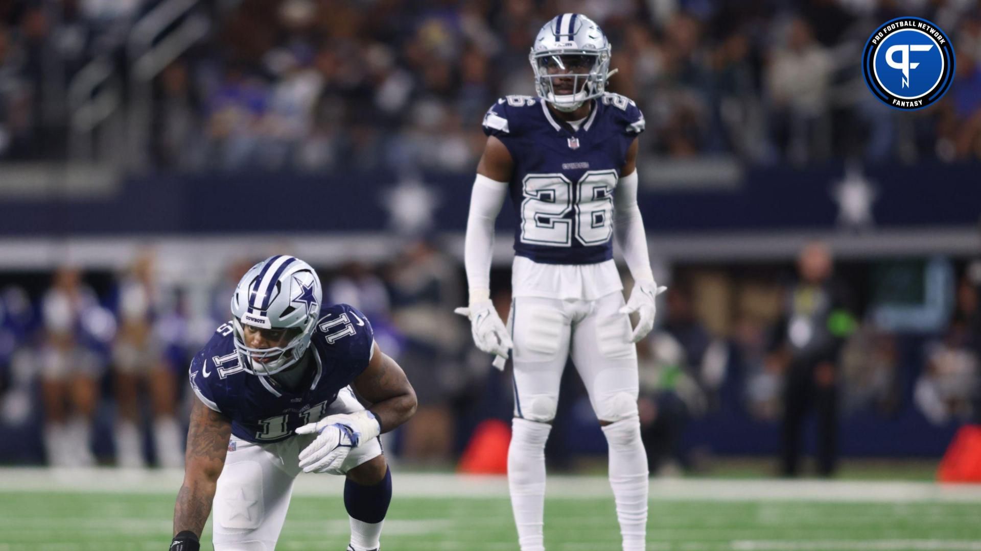 Micah Parsons (11) and cornerback DaRon Bland (26) on the field in the third quarter against the Los Angeles Rams at AT&T Stadium.