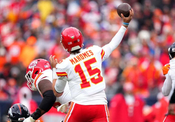 Kansas City Chiefs quarterback Patrick Mahomes (15) passes the ball for an interception in the second quarter against the Denver Broncos at Empower Field at Mile High.